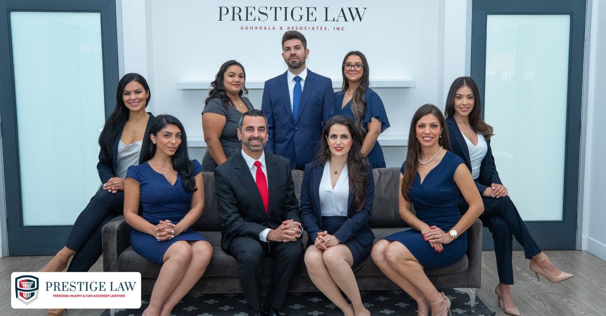 Crash-Prone Intersections in Los Angeles: Risks, Causes, and Safety Tips Prestige Law Frim P.C. team posing together in the firm’s office lobby, featuring attorneys and staff