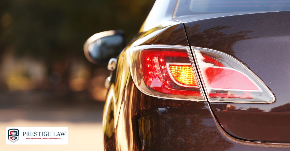 Car with hazard lights flashing after stalling on the road