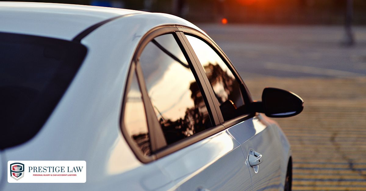 California Highway Patrol officer issuing a ticket to a driver for illegal window tint