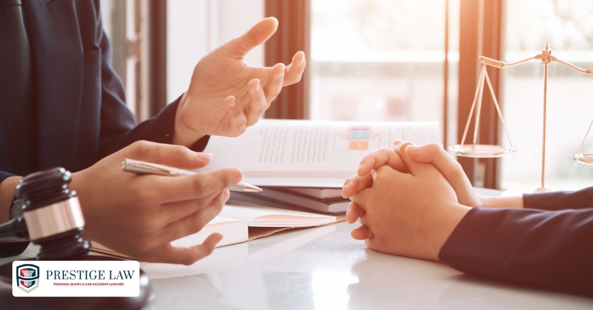 Client reviewing insurance claim denial with an attorney after a car accident in California.