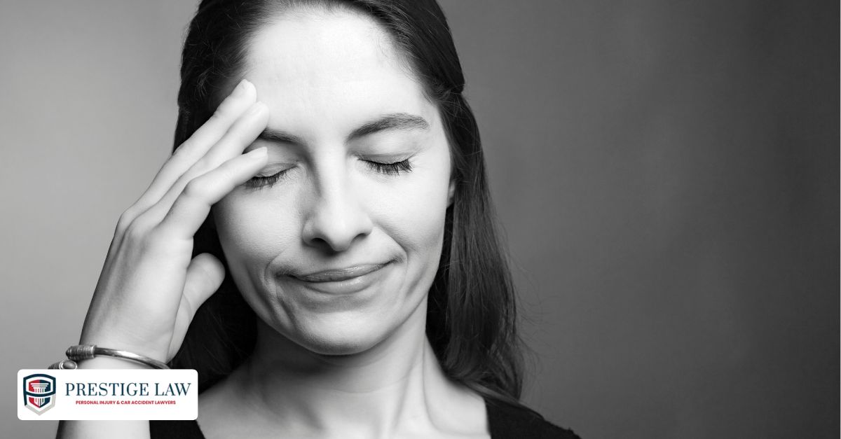 Is It Legal to Drive with a Concussion in California? Person holding their head in pain, showing signs of a concussion