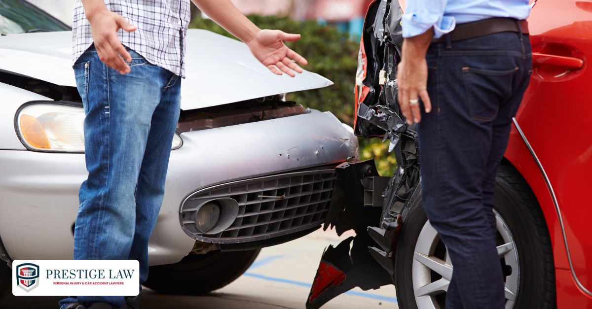 Distracted driver at crash scene speaking to police after causing an accident.