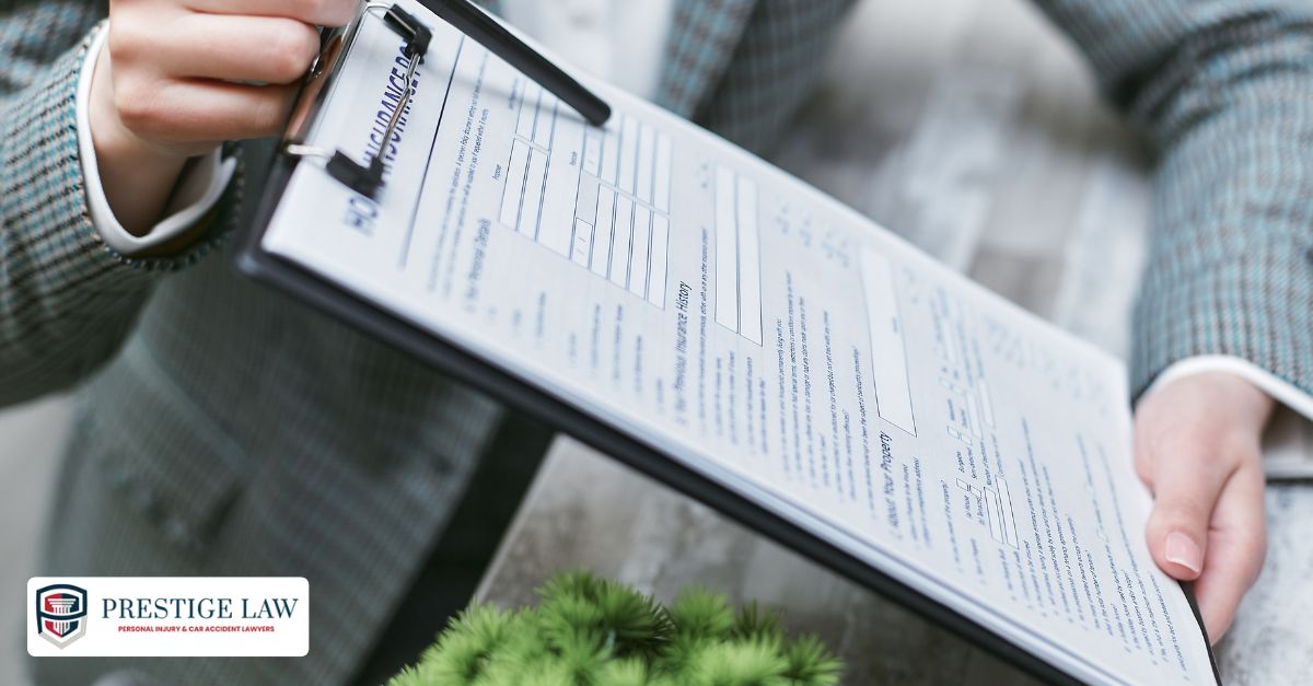 An insurance adjuster holds a clipboard with a liability report