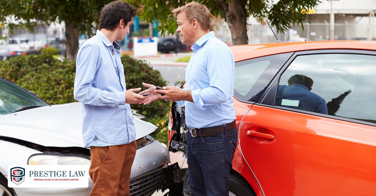 Two drivers exchange information after a minor accident